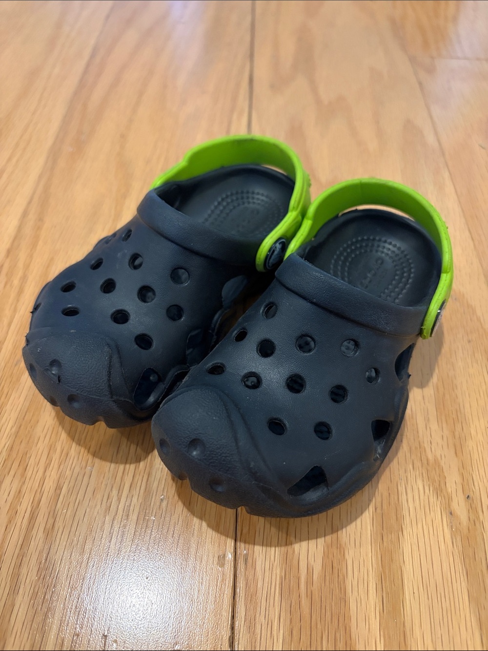 CROCS Kids Black Clogs with Bright Green Heel Strap